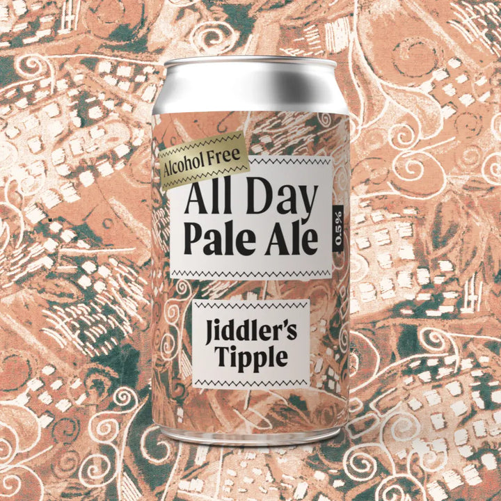 Jiddler's Tipple Alcohol-free All Day Pale Ale can on a decorative vintage shirt background