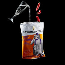 Savoursmiths  - Bubbly and Serrano Chili Luxury Potato Crisps 40g. Chillis and Bubbly bein g poured into an open crisp packet